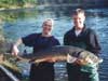 Dr. Edward Baker and Kregg Smith with a large lake sturgeon.