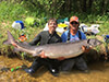 Two Men with a Large Sturgeon