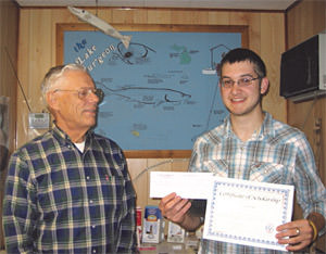 SFT Vice President Bob Bonner (left) presents a $500.00 scholar-ship to Luke Kaiser (right) from Lake Superior State University.